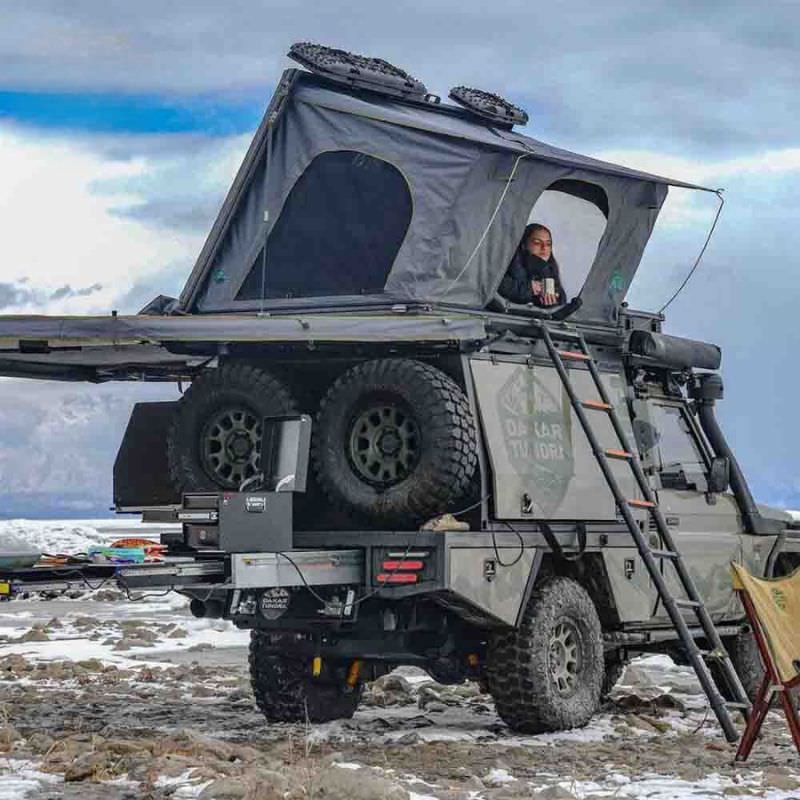ovs-sidewinder-hard-shell-roof-top-open-front-corner-view-on-toyota-land-cruiser-in-nature