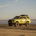 prinsu-toyota-4runner-roof-rack-full-non-drill-front-corner-view-on-vehicle-with-closed-roof-top-tent-on-the-beach