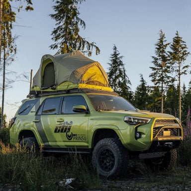 prinsu-toyota-4runner-roof-rack-full-non-drill-front-corner-view-on-vehicle-with-open-roof-top-tent-in-nature