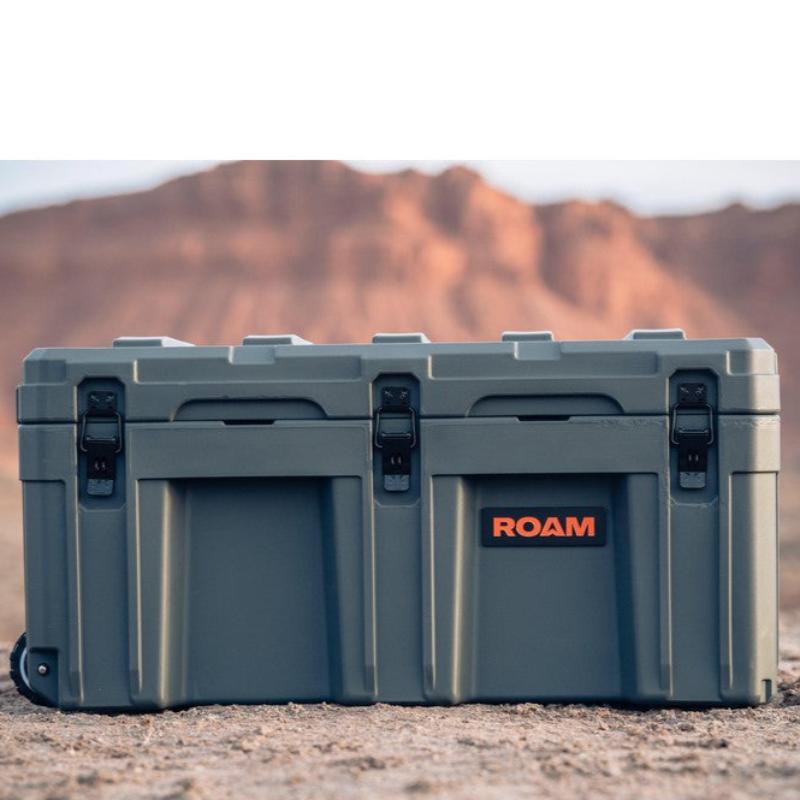 roam-125l-rolling-rugged-case-slate-front-view-on-terrain