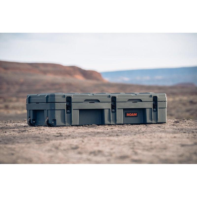 roam-128l-rolling-rugged-case-slate-front-corner-view-on-ground
