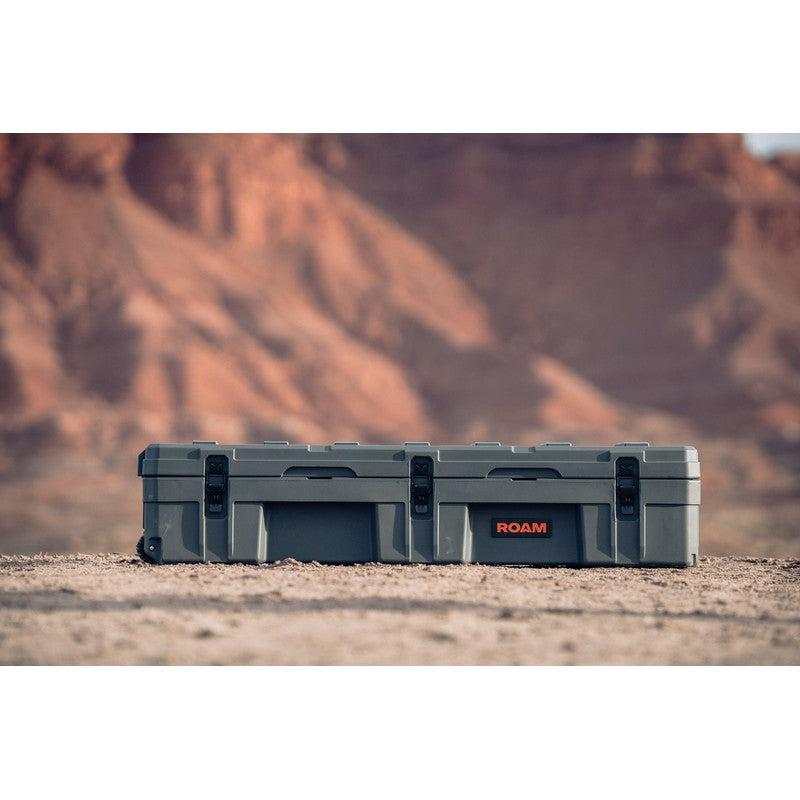 roam-128l-rolling-rugged-case-slate-front-view-on-terrain