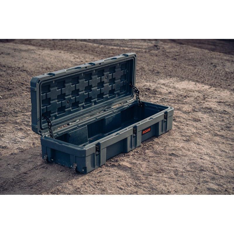 roam-128l-rolling-rugged-case-slate-open-front-corner-view-on-desert