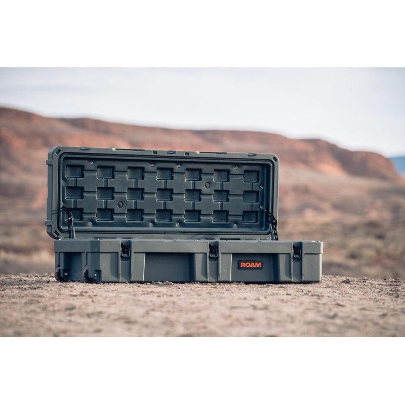 roam-128l-rolling-rugged-case-slate-open-front-corner-view-on-terrain