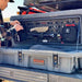roam-160l-rugged-case-molle-panel-front-corner-view-on-rugged-case-with-person-in-nature