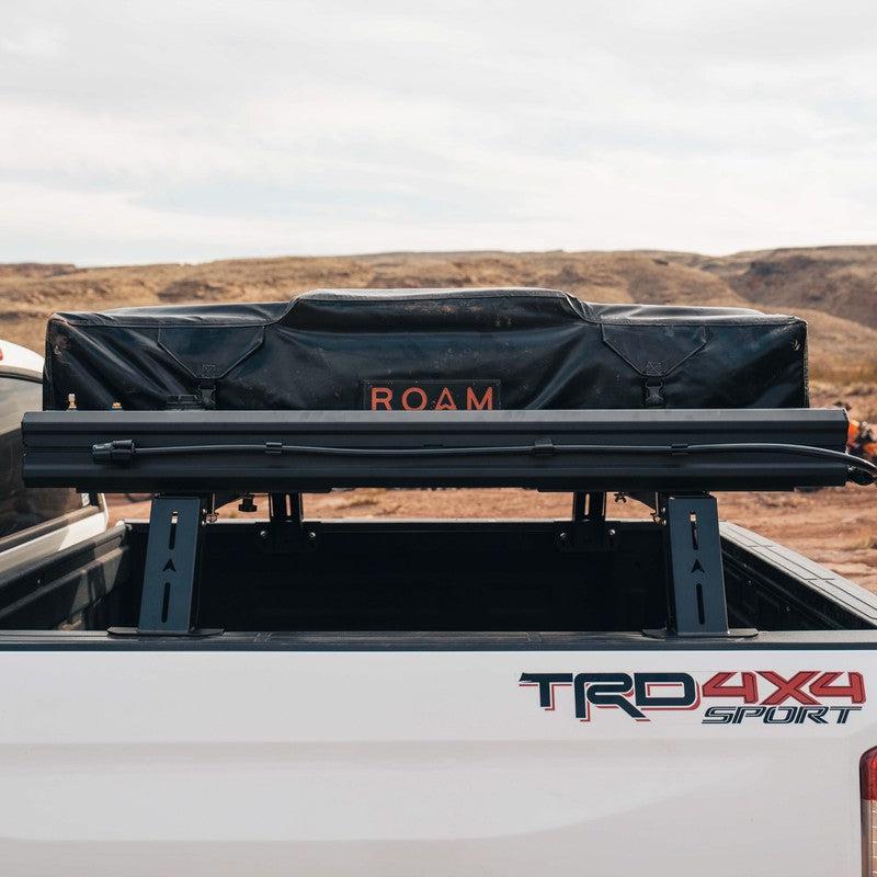 roam-7-gallon-water-tank-front-view-on-vehicle-on-terrain