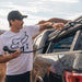 roam-7-gallon-water-tank-front-view-with-person-on-terrain