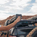 roam-7-gallon-water-tank-side-view-with-person-on-terrain