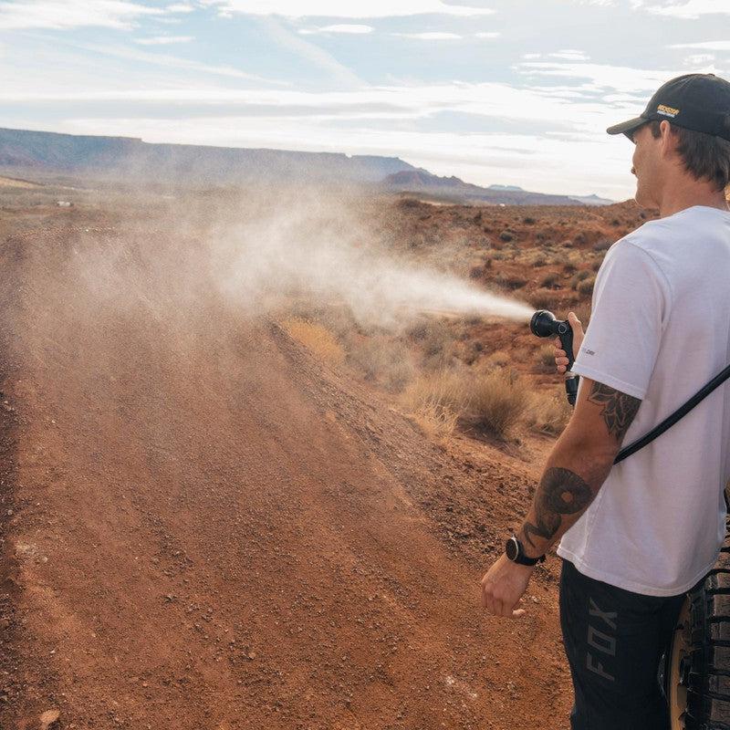 roam-7-gallon-water-tank-spray-side-view-with-person-on-terrain