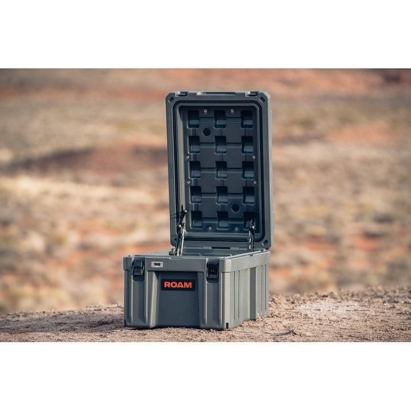 roam-86l-rugged-case-slate-open-front-corner-view-in-terrain