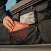 roam-95l-lid-organizer-clpse-up-view-on-rugged-case-with-person