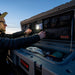 roam-95l-lid-organizer-front-corner-view-on-rugged-case-with-person-on-vehicle