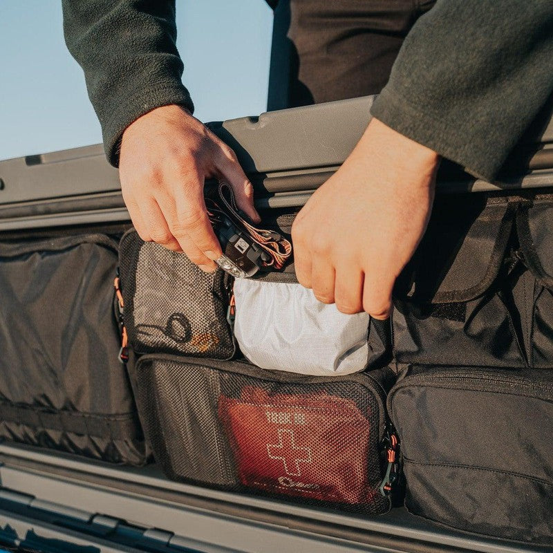 roam-95l-lid-organizer-front-corner-view-on-rugged-case-with-person
