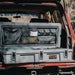 roam-95l-lid-organizer-front-view-on-rugged-case-on-vehicle-in-nature