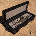 roam-95l-rugged-case-foam-insert-front-corner-view-in-rugged-case-with-weapon-on-desert