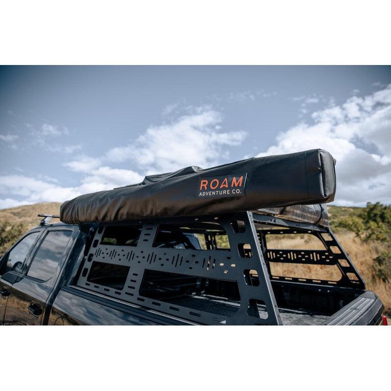 roam-arc-270-awning-driver-side-closed-close-up-view-with-road-cover-in-nature