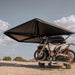 roam-arc-270-awning-driver-side-open-interior-view-with-motorcyle-in-nature
