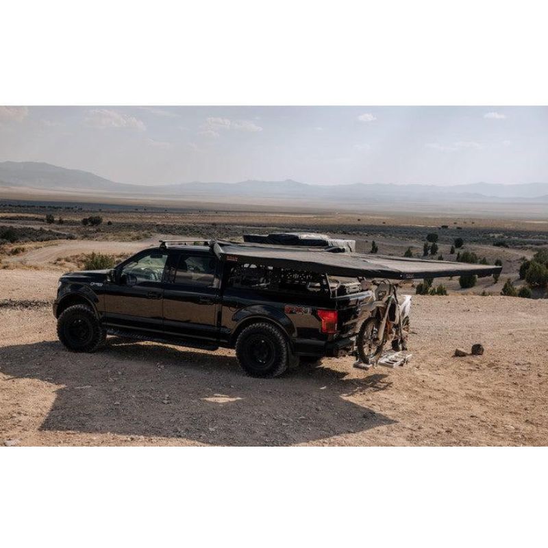 roam-arc-270-awning-driver-side-open-side-view-with-motorcyle-in-nature