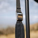 roam-arc-270-awning-open-close-up-view-with-metal-cinch-strap-in-nature