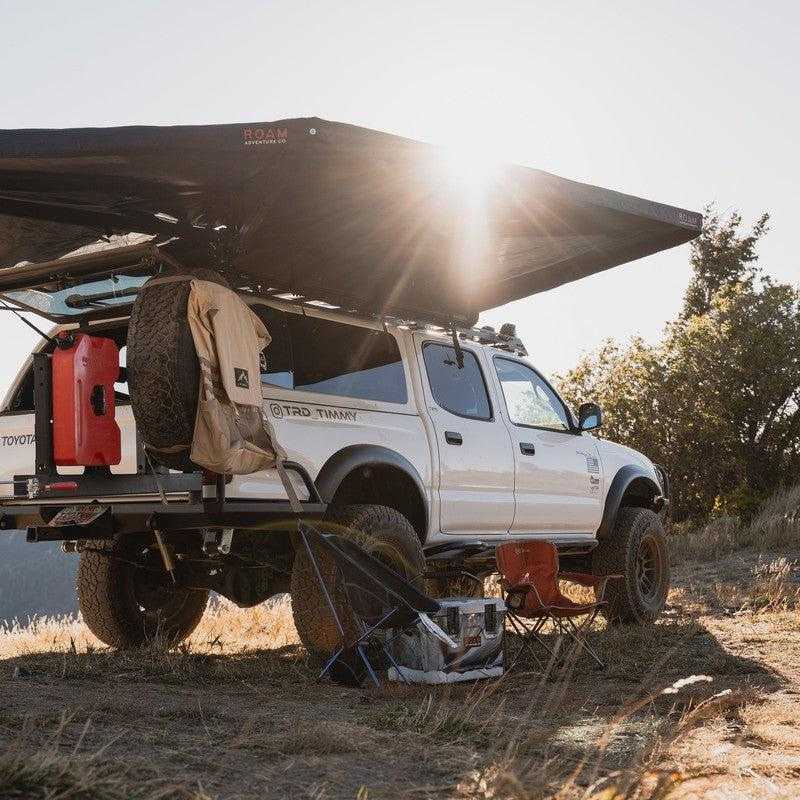 roam-arc-270-awning-passenger-side-open-interior-view-in-nature