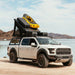 roam-desperado-hardshell-rooftop-tent-open-rear-corner-view-with-roam-case-in-nature
