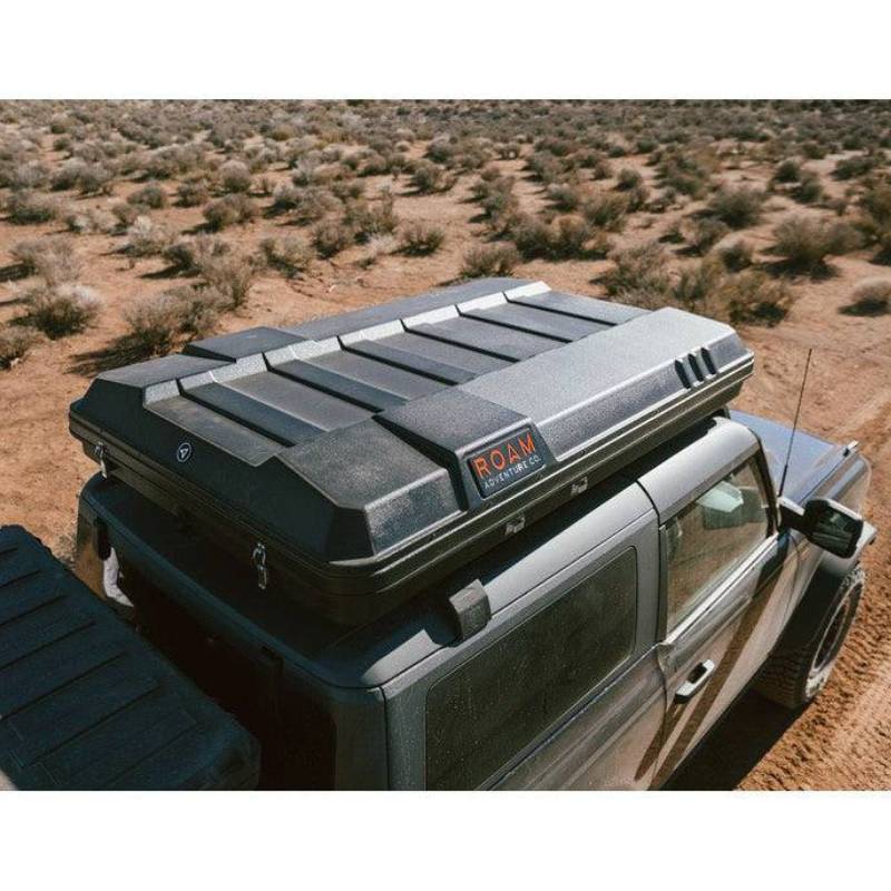 roam-rambler-hardshell-rooftop-tent-closed-drone-view-in-nature