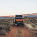 roam-rambler-hardshell-rooftop-tent-closed-rear-view-in-nature
