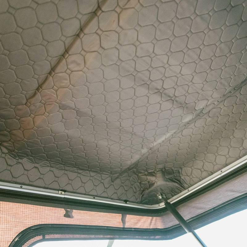 roam-rambler-hardshell-rooftop-tent-open-close-up-view-with-roof-insulation