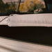 roam-rambler-hardshell-rooftop-tent-open-close-up-view-with-mattress-in-nature