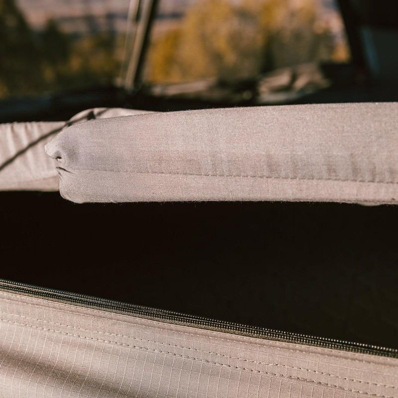 roam-rambler-hardshell-rooftop-tent-open-close-up-view-with-mattress-in-nature