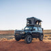 roam-rambler-hardshell-rooftop-tent-open-front-corner-view-in-nature