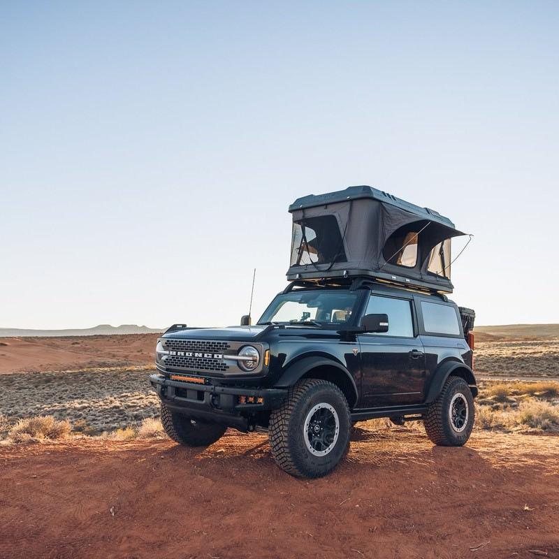 roam-rambler-hardshell-rooftop-tent-open-front-corner-view-in-nature