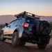 roam-rooftop-awnings-closed-front-corner-view-on-vehicle-in-nature