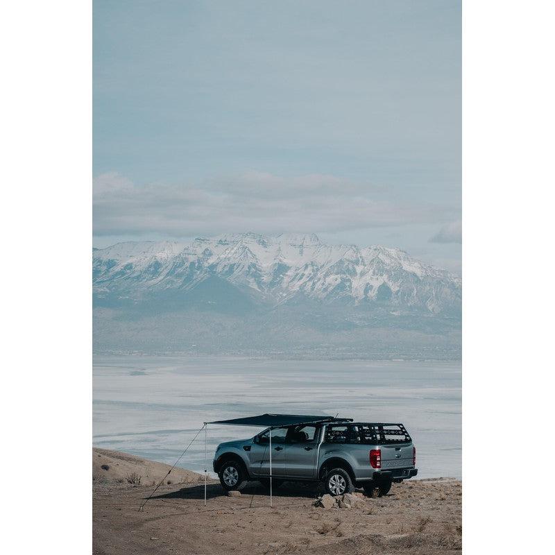 roam-rooftop-awnings-open-front-corner-view-on-vehicle-on-mountain