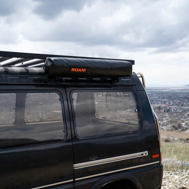 roam-shower-room-close-front-corner-view-on-vehicle-in-nature