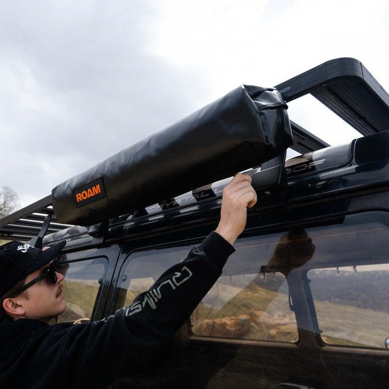 roam-shower-room-close-front-corner-view-on-vehicle-with-person-in-nature