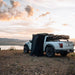roam-shower-room-front-corner-view-with-vehicle-in-nature