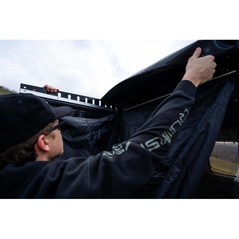roam-shower-room-open-front-corner-view-on-vehicle-with-person-in-nature