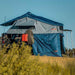 roam-vagabond-tent-annex-room-slate-grey-navy-blue-open-side-view-on-vehicle-in-nature