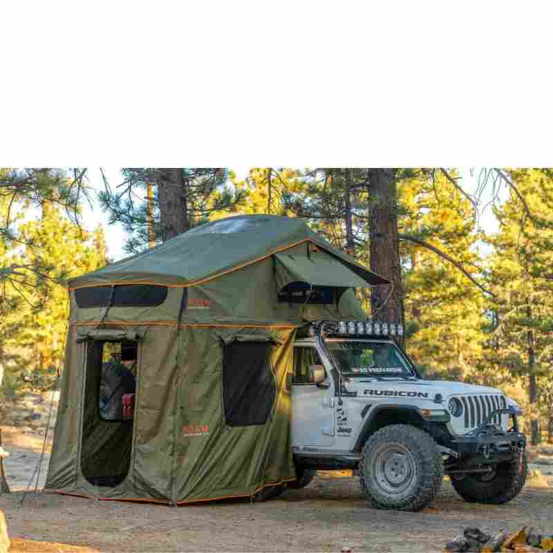 roam-vagabond-xl-rooftop-tent-forest-green-hyper-orange-open-front-corner-view-on-jeep-wrangler-rubicon-with-annex-in-nature