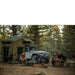roam-vagabond-xl-rooftop-tent-forest-green-hyper-orange-open-front-corner-view-with-persons-in-nature