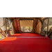 roam-vagabond-xl-rooftop-tent-forest-green-hyper-orange-open-interior-view-with-anti-condensation-mat-in-nature