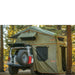 roam-vagabond-xl-rooftop-tent-forest-green-hyper-orange-open-side-view-on-jeep-wrangler-rubicon-with-annex-in-nature