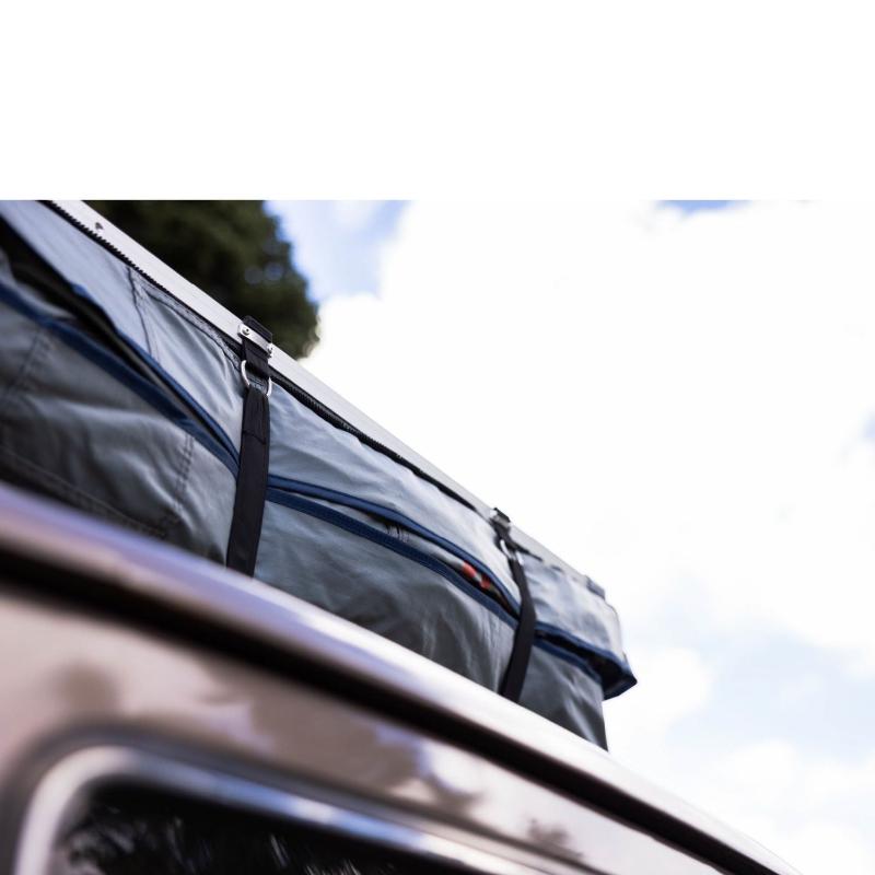 roam-vagabond-xl-rooftop-tent-slate-gray-navy-blue-closed-close-up-view-with-velcro-strap-in-nature
