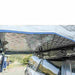 roam-vagabond-xl-rooftop-tent-slate-gray-navy-blue-open-close-up-view-with-aluminum-base-in-nature