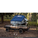 roam-vagabond-xl-rooftop-tent-slate-gray-navy-blue-open-front-corner-view-on-toyota-land-cruiser-with-dual-skylights-in-nature