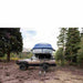 roam-vagabond-xl-rooftop-tent-slate-gray-navy-blue-open-front-view-on-toyota-land-cruiser-with-ladder-in-nature