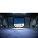 roam-vagabond-xl-rooftop-tent-slate-gray-navy-blue-open-interior-view-with-mattress-in-nature