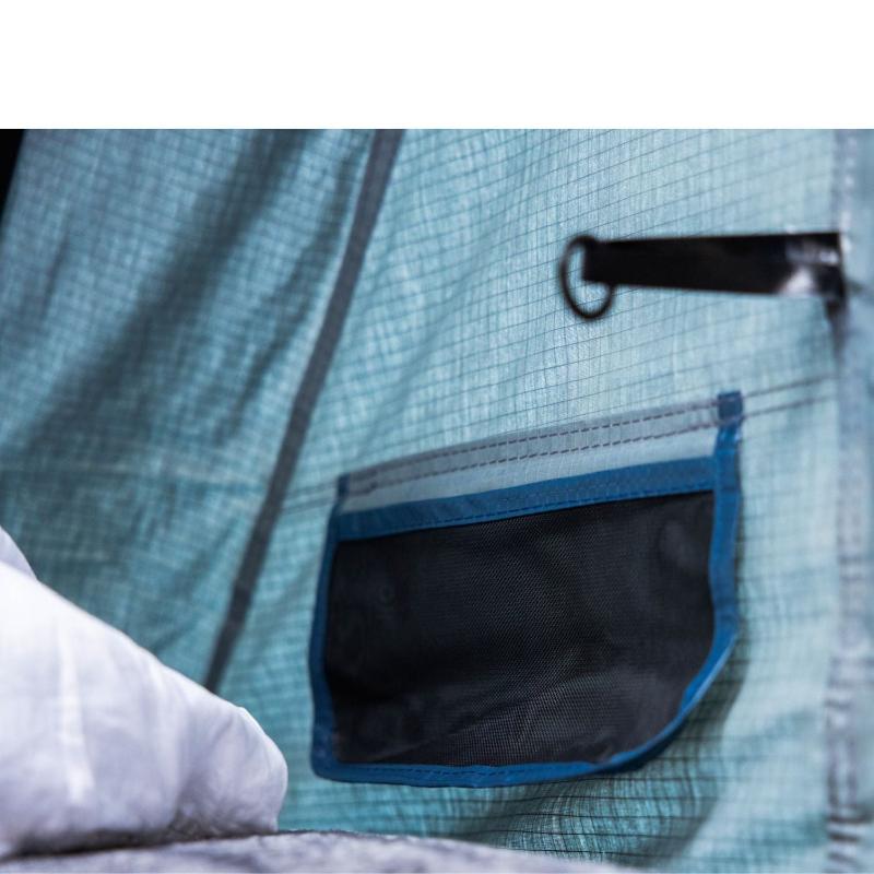 roam-vagabond-xl-rooftop-tent-slate-gray-navy-blue-open-interior-view-with-pocket
