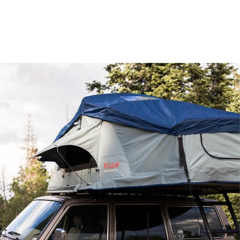 roam-vagabond-xl-rooftop-tent-slate-gray-navy-blue-open-side-view-on-toyota-land-cruiser-in-nature
